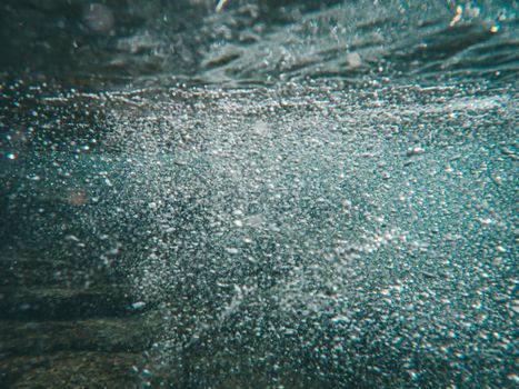 A mesmerizing close-up of bubbles in underwater scenery, creating a dynamic visual.