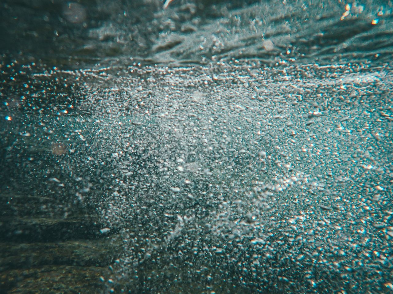 a mesmerizing close up of bubbles in underwater scenery creating a dyn