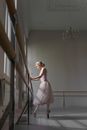 Woman in Pink Dress Standing on Staircase
