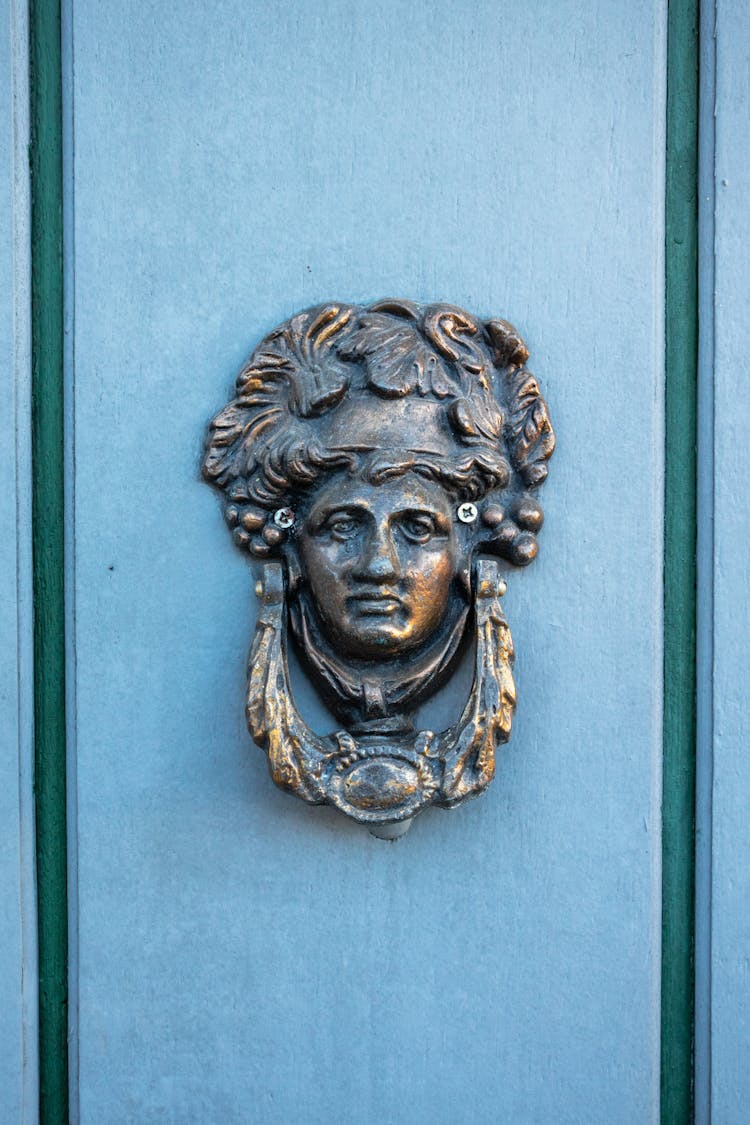 Decorative Brass Knocker On Door