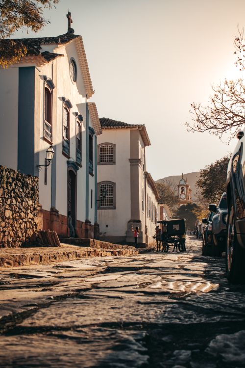 Free A scenic view of Tiradentes, Brazil, showcasing colonial architecture and cobblestone streets at sunset. Stock Photo