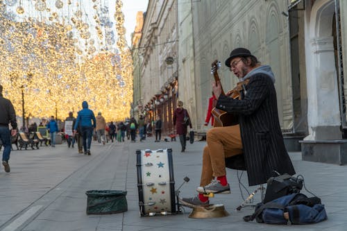 Street Performer Playing Musical Instruments 