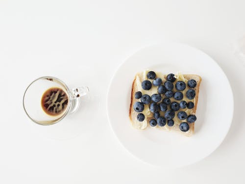 Free Black Coffee and Bread with Blueberries on White Ceramic Plate Stock Photo