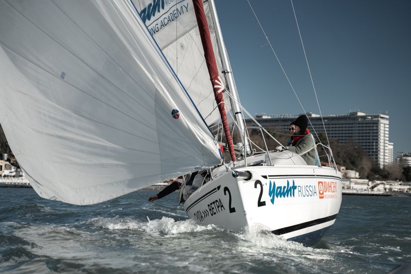 Sailing yacht underway with crew on deck