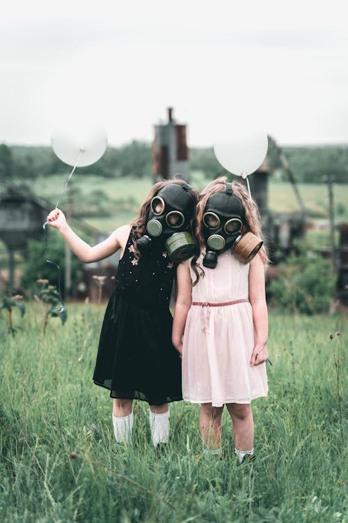 Kids with Gas Mask Holding a Balloon