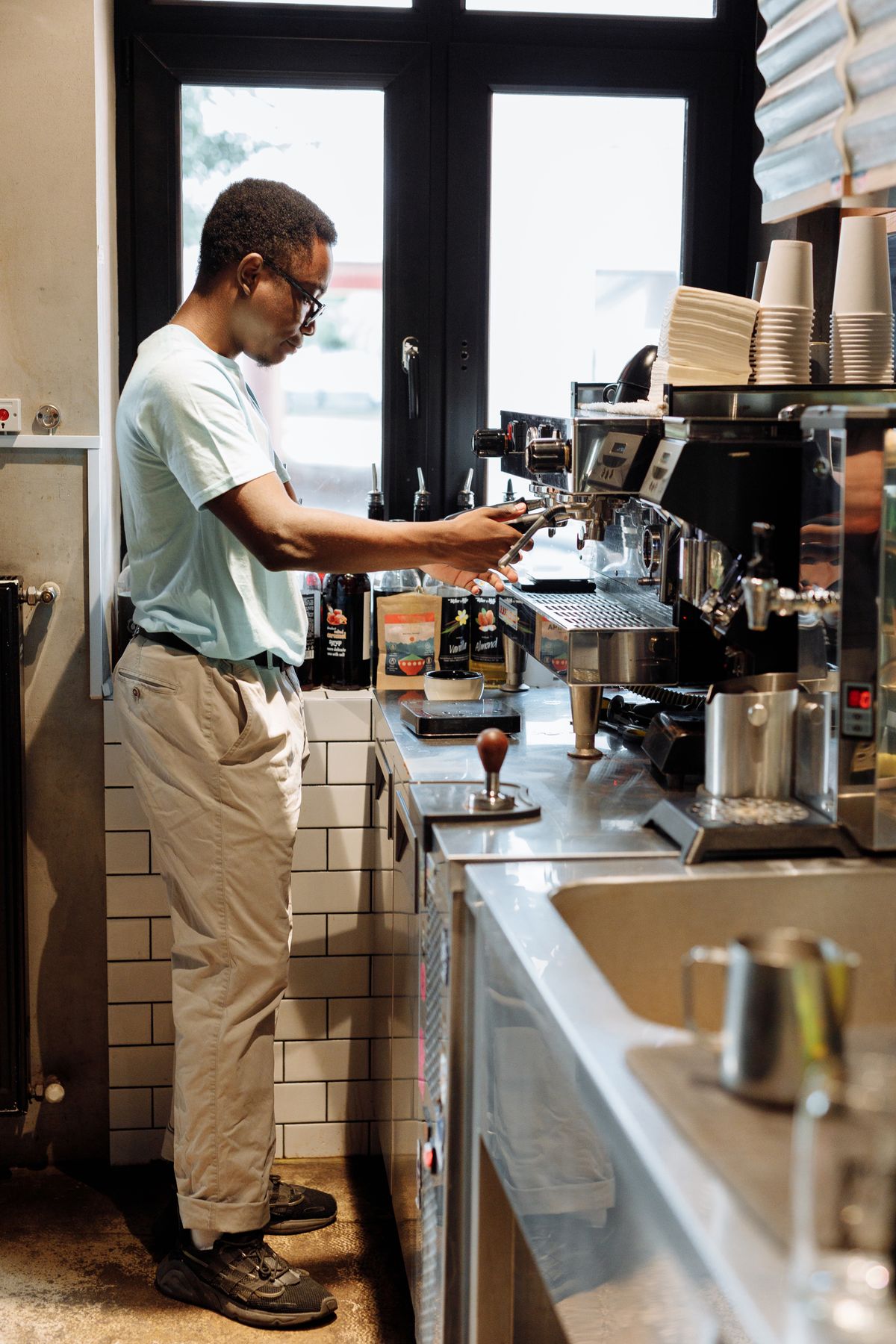 Barista preparing coffee at an espresso machine