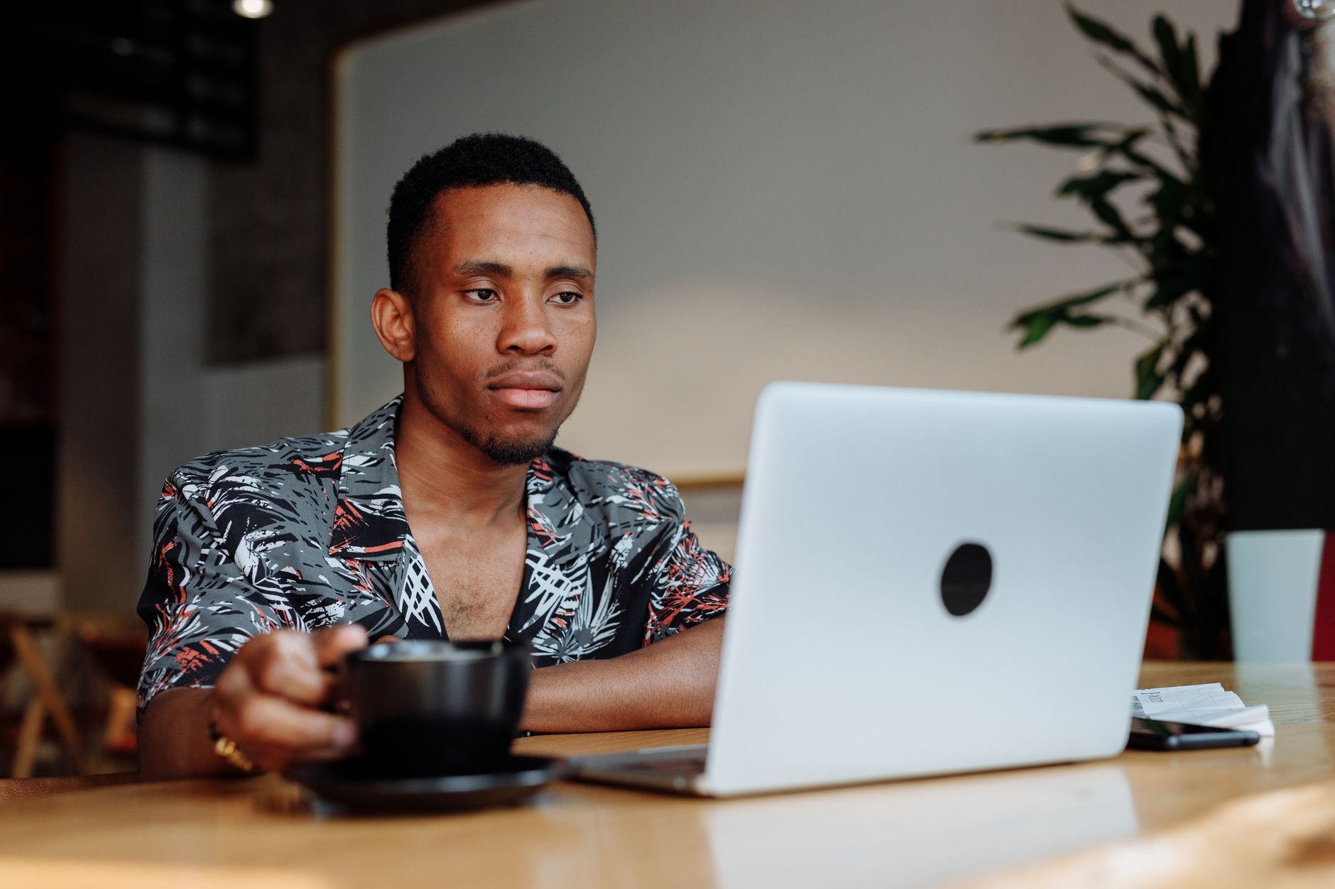 creative professional headshot with laptop and coffee