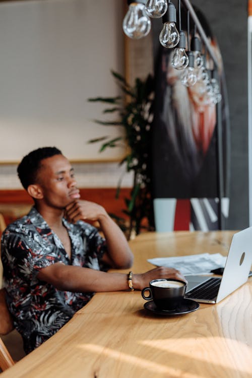 Free Man Working on a Laptop Stock Photo