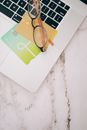 Green and White Card on White Textile