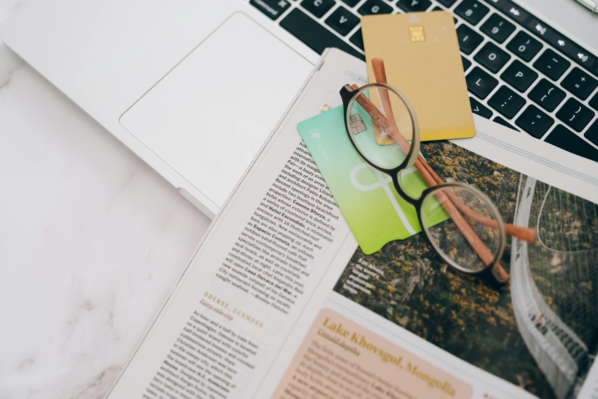 Eyeglasses and Credit Cards on a Newspaper