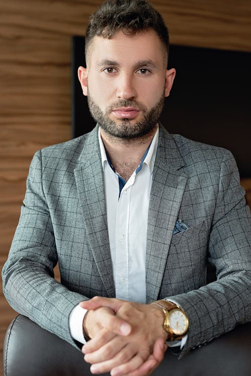 Handsome Man in Gray Plaid Suit Jacket With Facial Hair