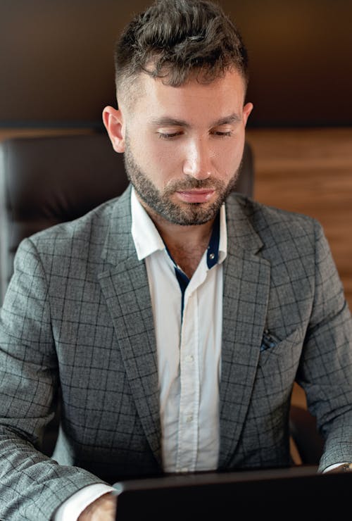 A Bearded Man Wearing Gray Suit