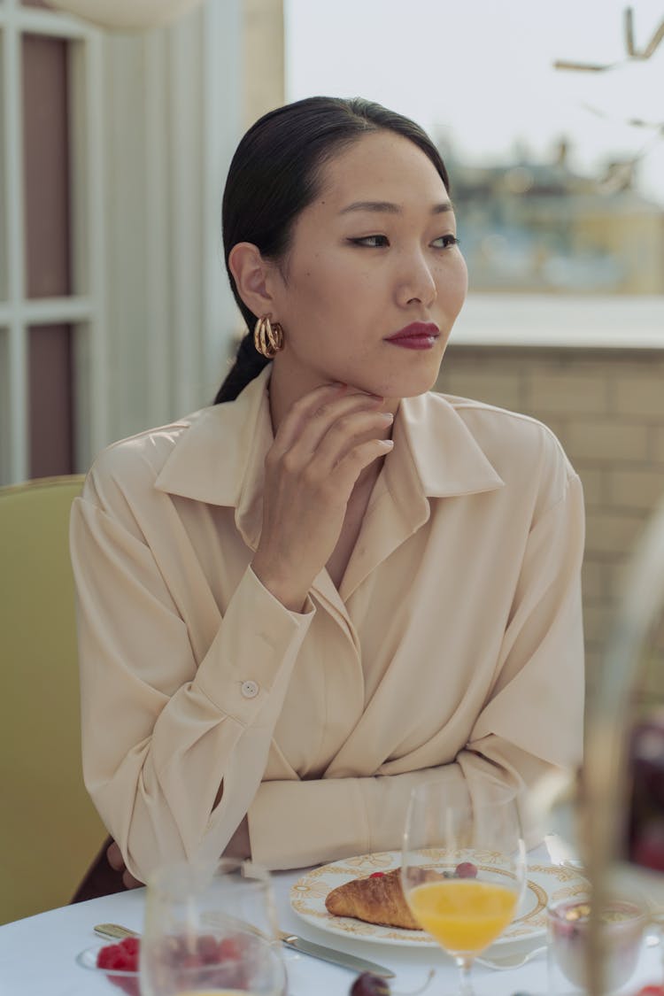 Woman Wearing Long Sleeves Polo Having Breakfast