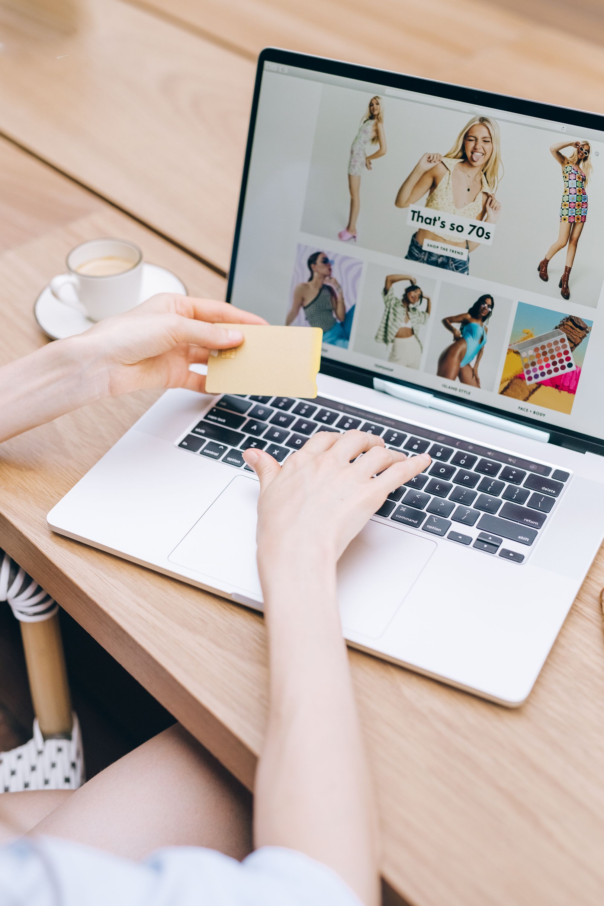Person using a credit card while shopping online