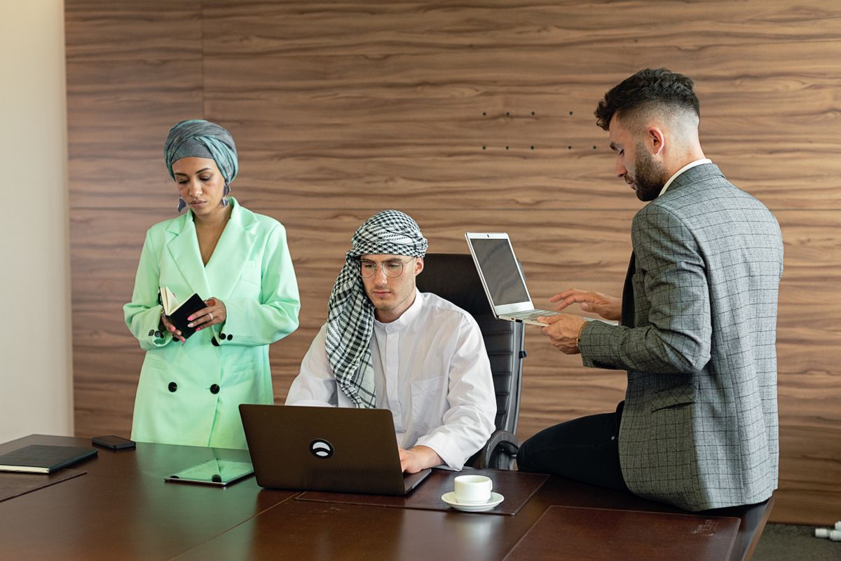 Middle Eastern business professionals using outsourced PRO support