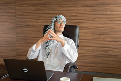 A Man Sitting on the Office Chair 