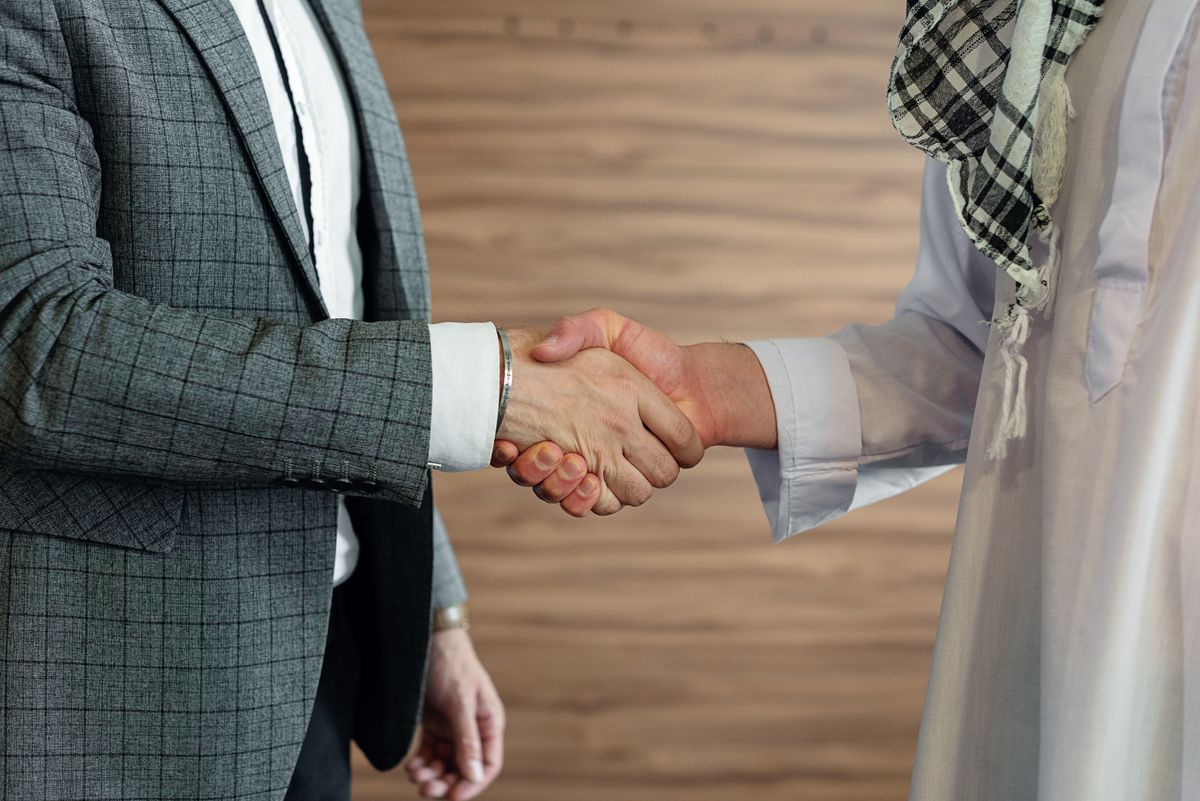 Business partners shaking hands in Dubai