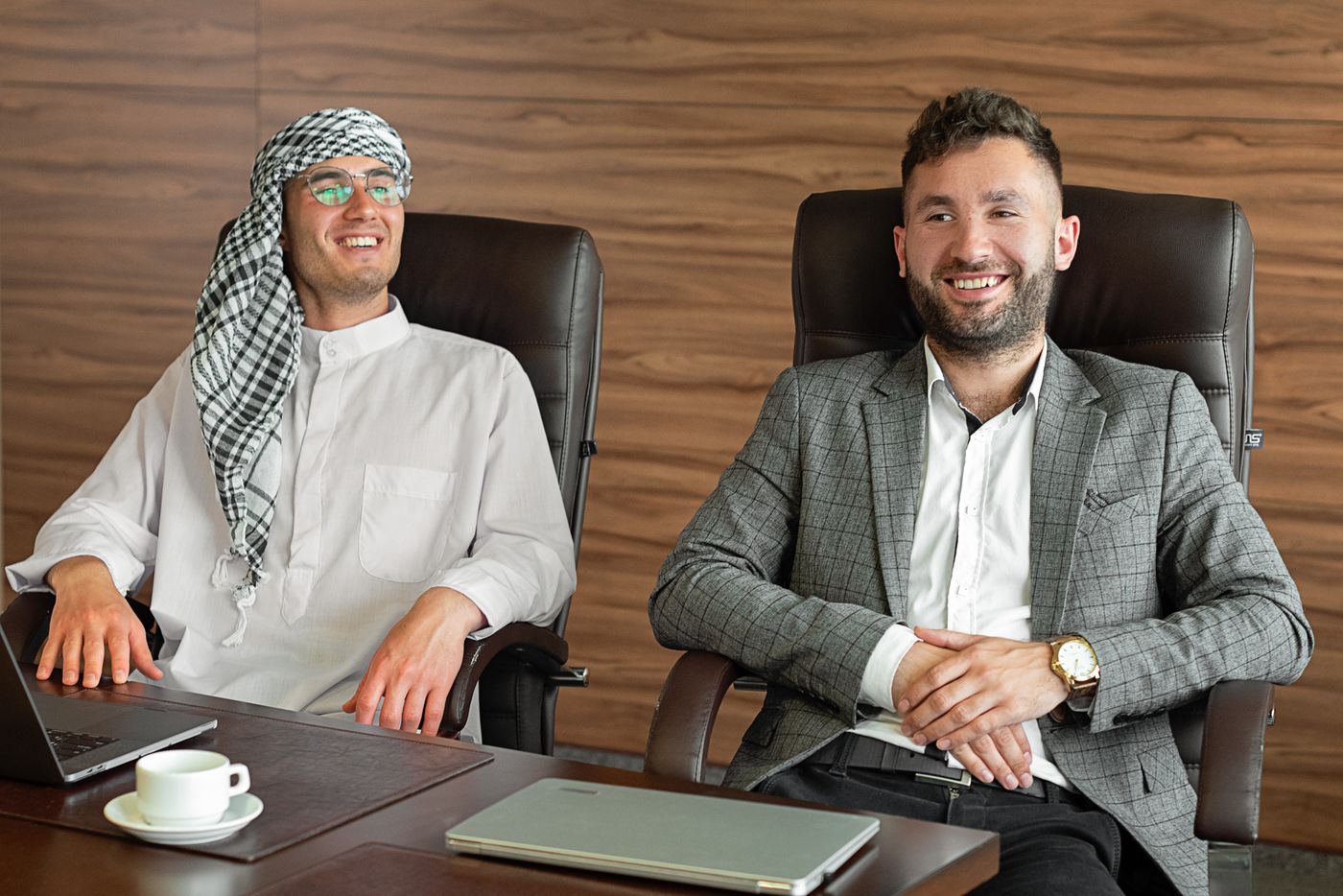 Arab and international business professionals collaborating in a modern office