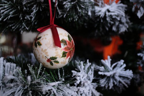 White Christmas Bauble Hanging on a Christmas tree