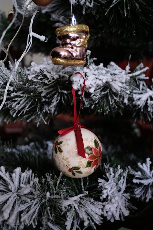 Christmas Ornaments Hanging on Frosted Fir Tree
