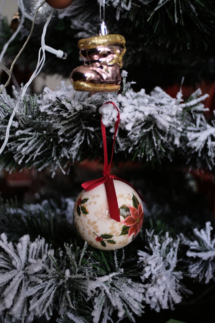 Christmas Ornaments Hanging On Frosted Fir Tree