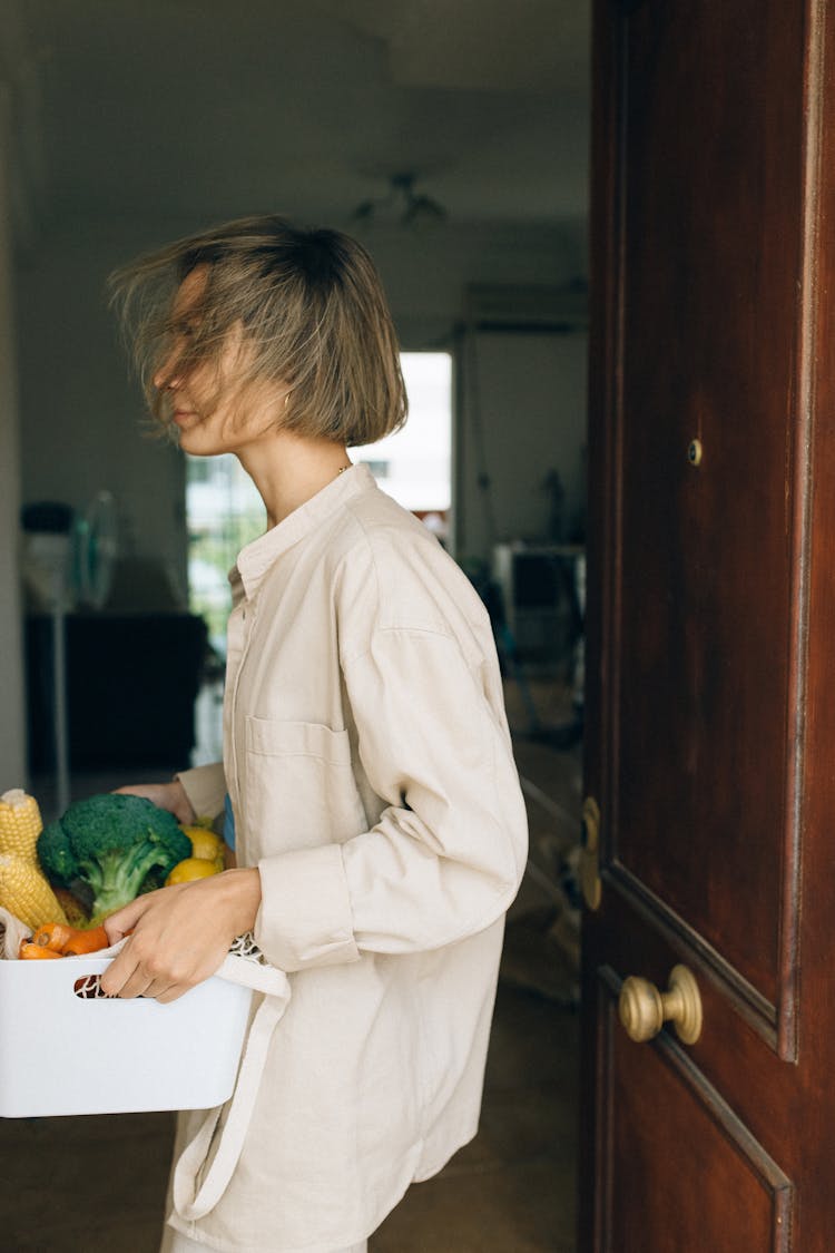 A Woman Carrying Vegetables 