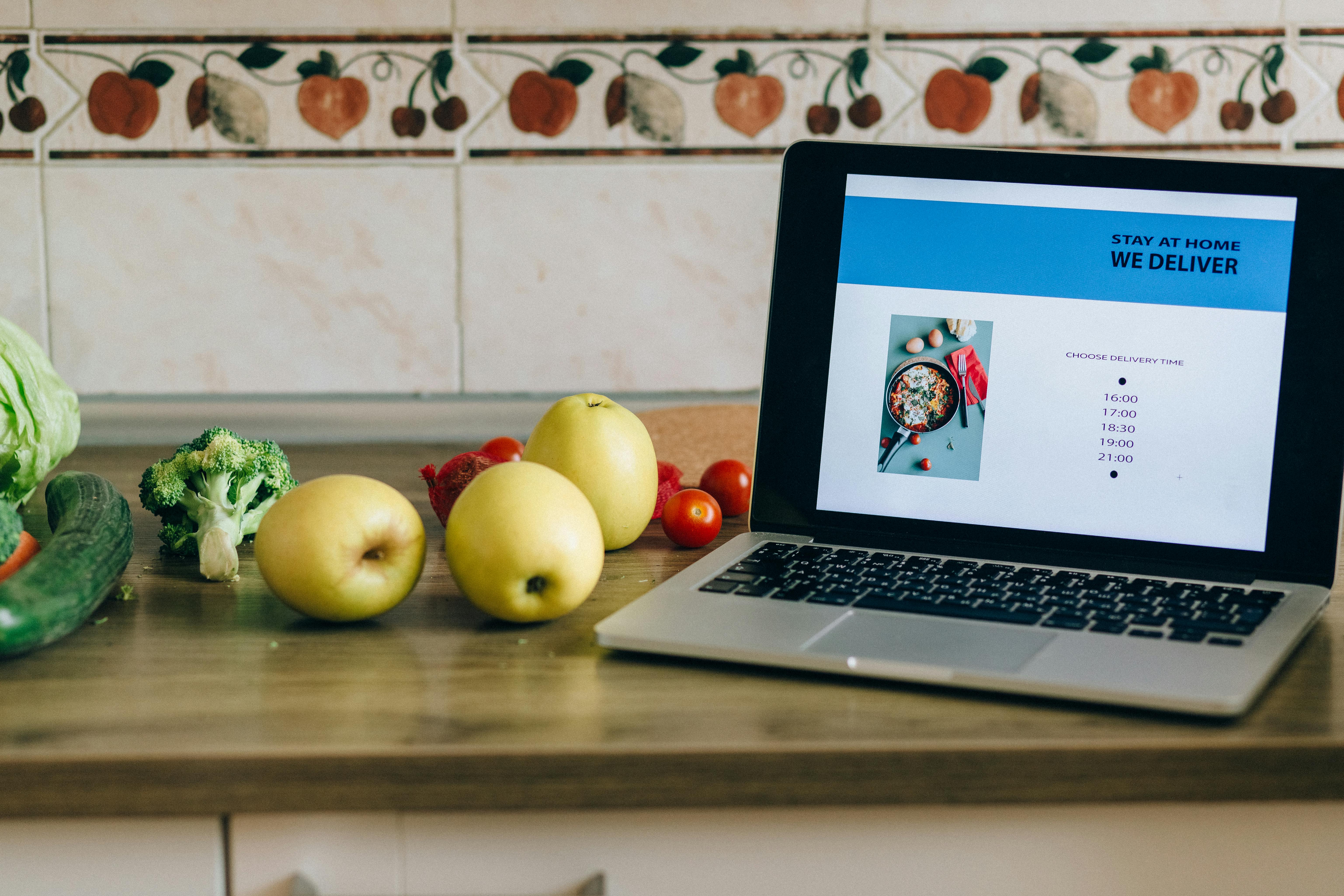 fruits and vegetables near the laptop