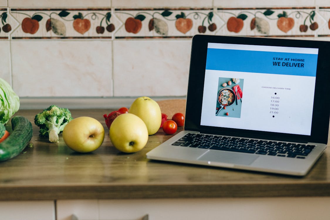 Free Fruits and Vegetables Near the Laptop Stock Photo