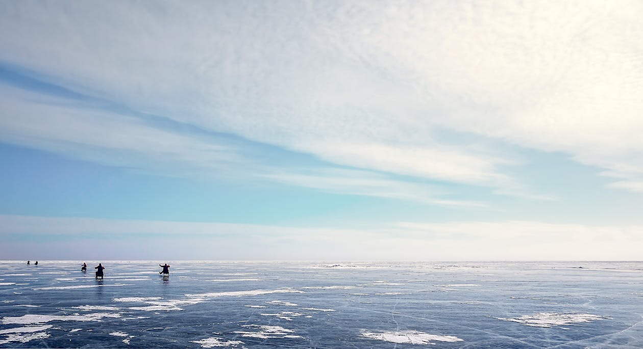 Photo of Five People on Ice Field