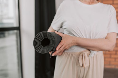 Close Shot of a Person Holding Yoga Mat