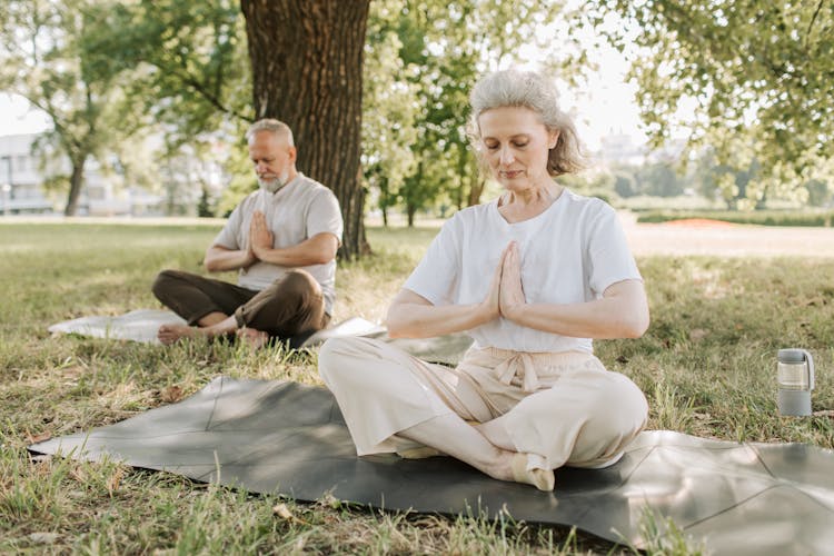 Photo Of An Elderly Couple Doing Yoga Together