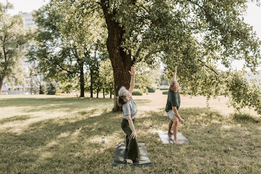 Senior couple enjoying yoga practice outdoors, promoting a healthy and active lifestyle.