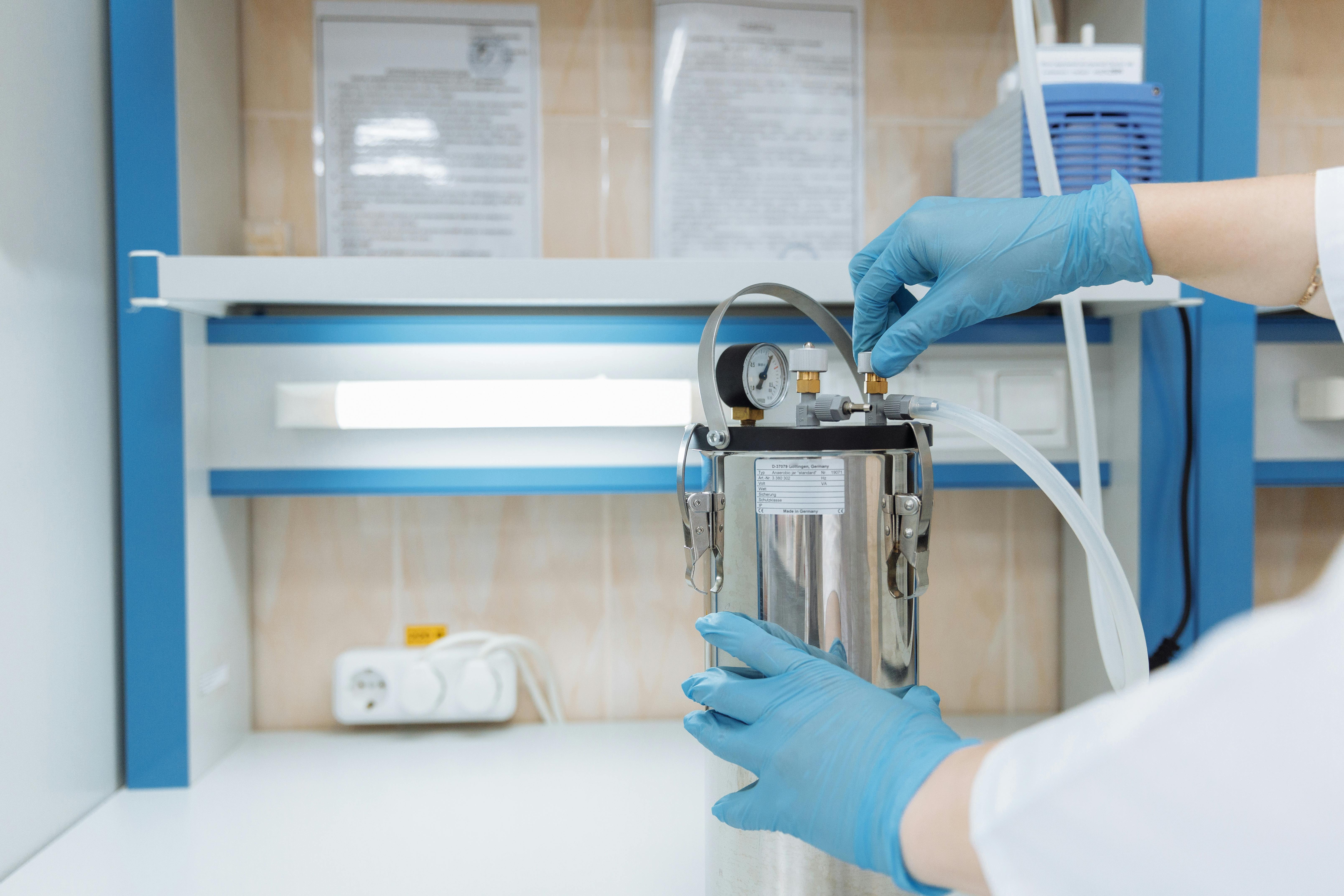 Laboratory bench with peptide vials and analytical equipment