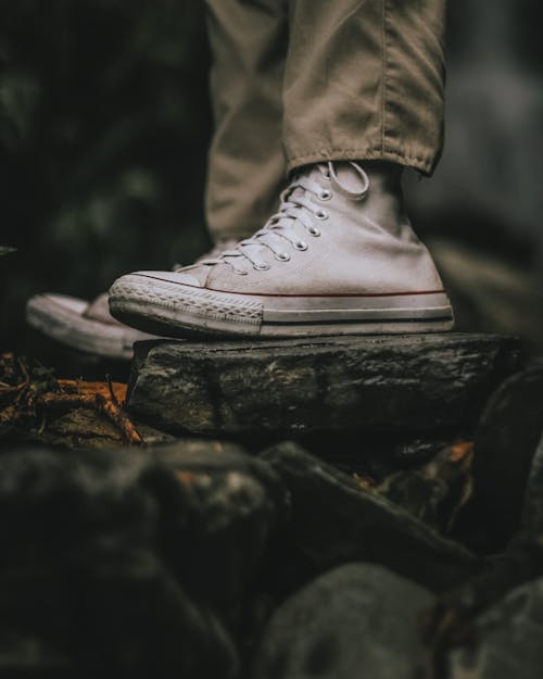 Free A Person Wearing White High Cur Sneakers Stock Photo