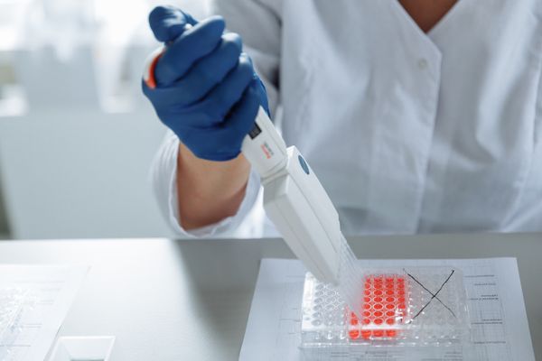 Scientist using a pipette in a sterile lab — photo by Thirdman on Pexels