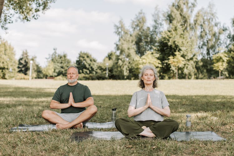 An Elderly Couple Meditating 