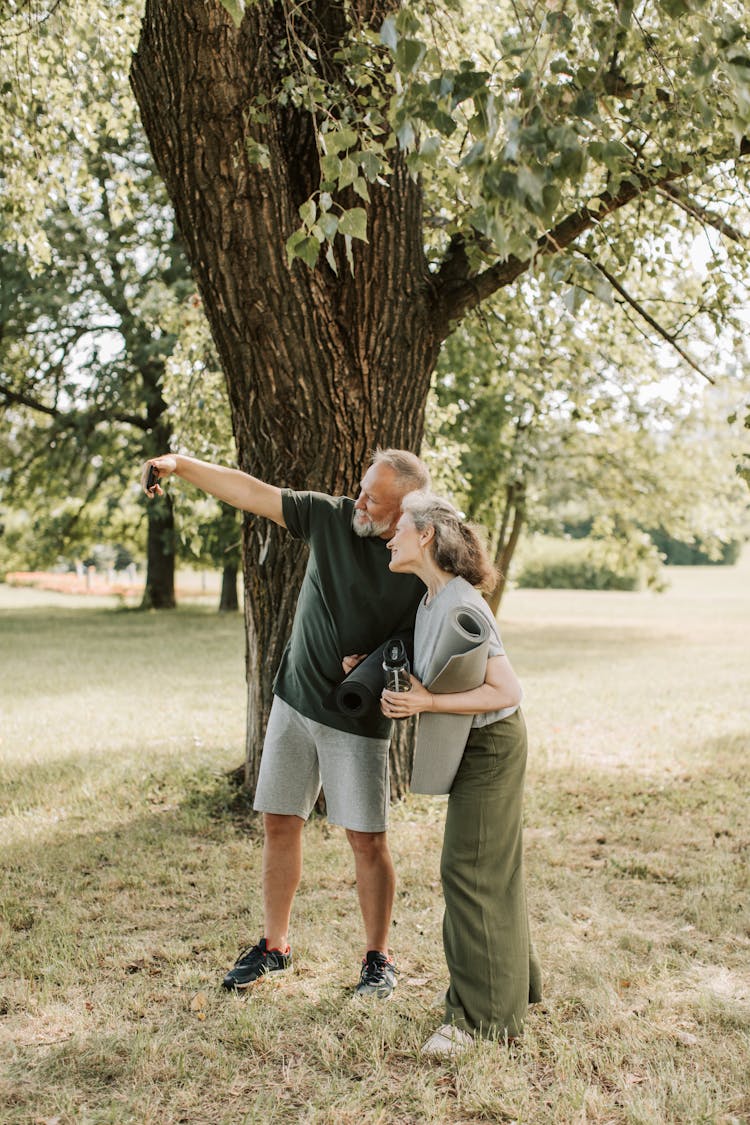 An Elderly Couple Taking A Selfie