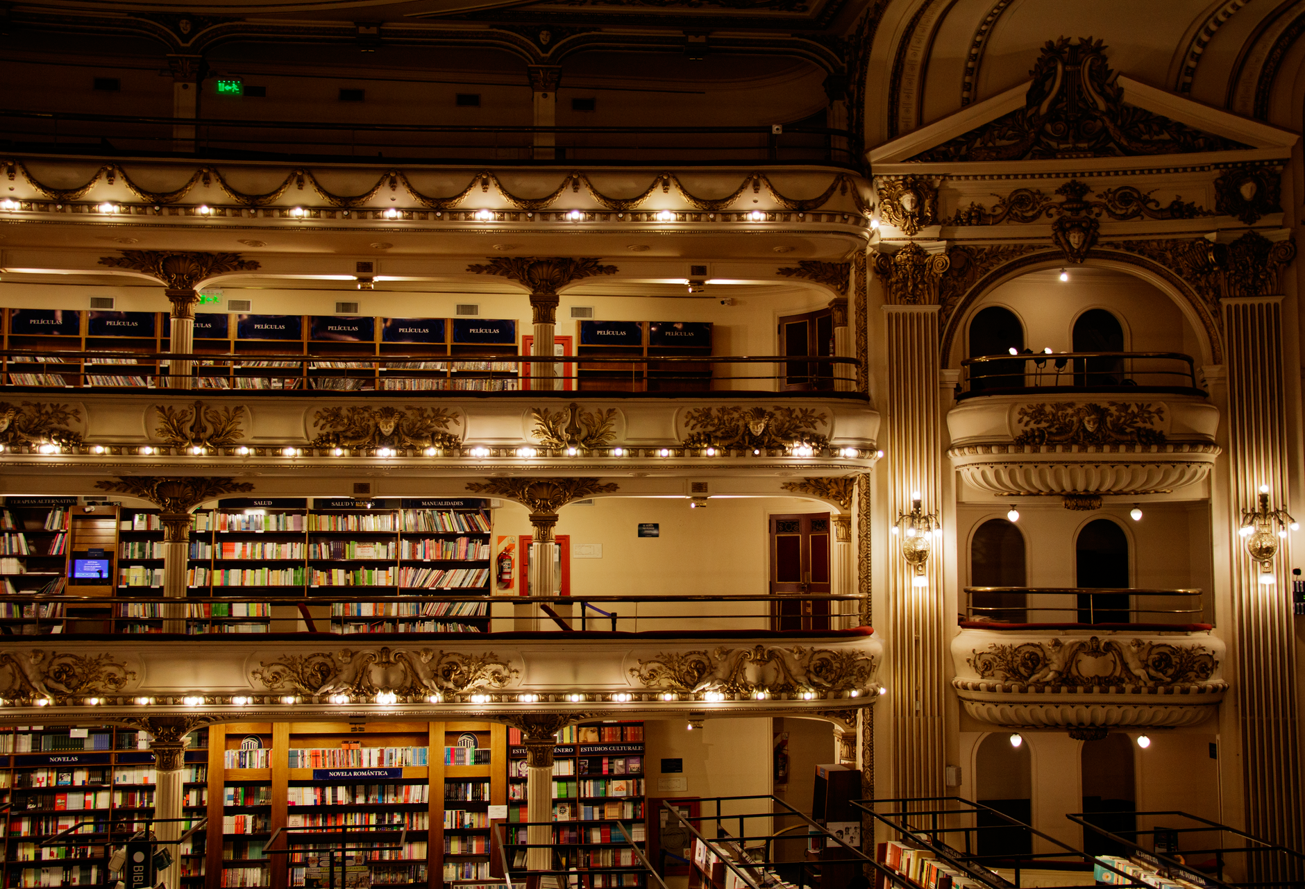 Grand illuminated library with balconies of books