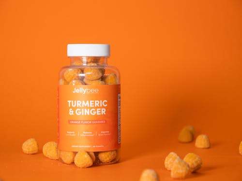 Free Turmeric and Ginger Gummies In Plastic Bottle Stock Photo
