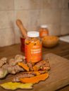 Orange Plastic Bottle on Brown Wooden Table