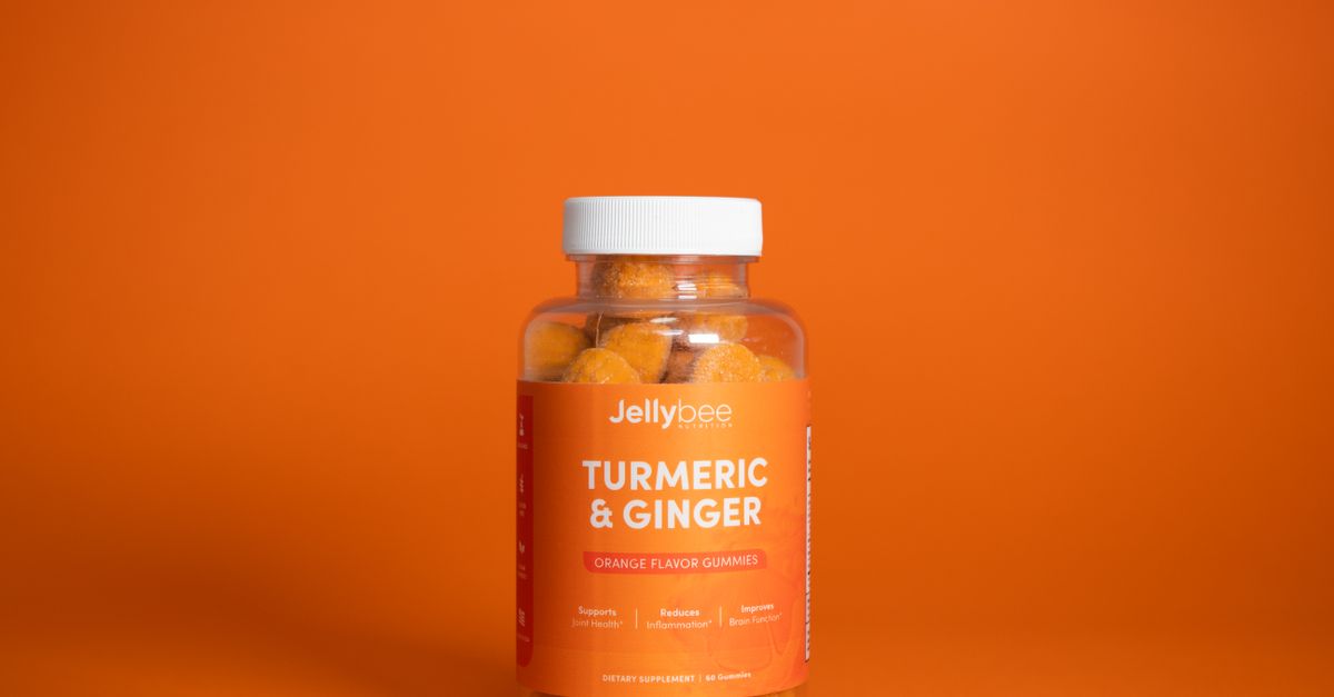 Bright image of Jellybee Turmeric & Ginger gummies in a plastic bottle against an orange backdrop. - Evidence evidence guide for turmeric inflammation randomized trial