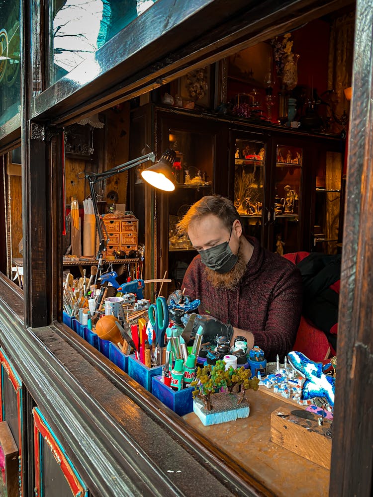 Man Working In Antique Shop