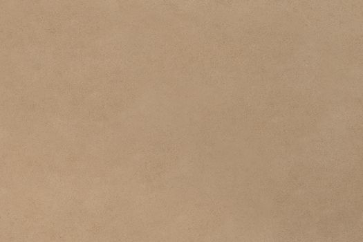 Beige textured wall surface ideal for backgrounds or design projects.