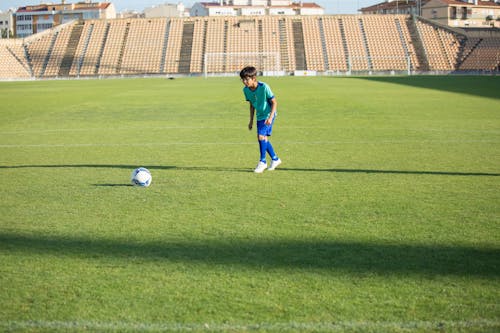Free Boy Playing Soccer Stock Photo