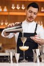 A Man Sifting a Cocktail