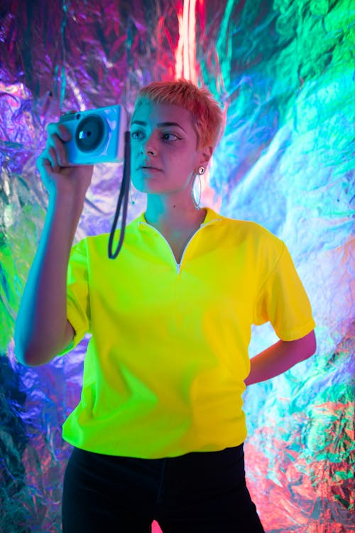 A Woman with Short Hair Holding a Camera