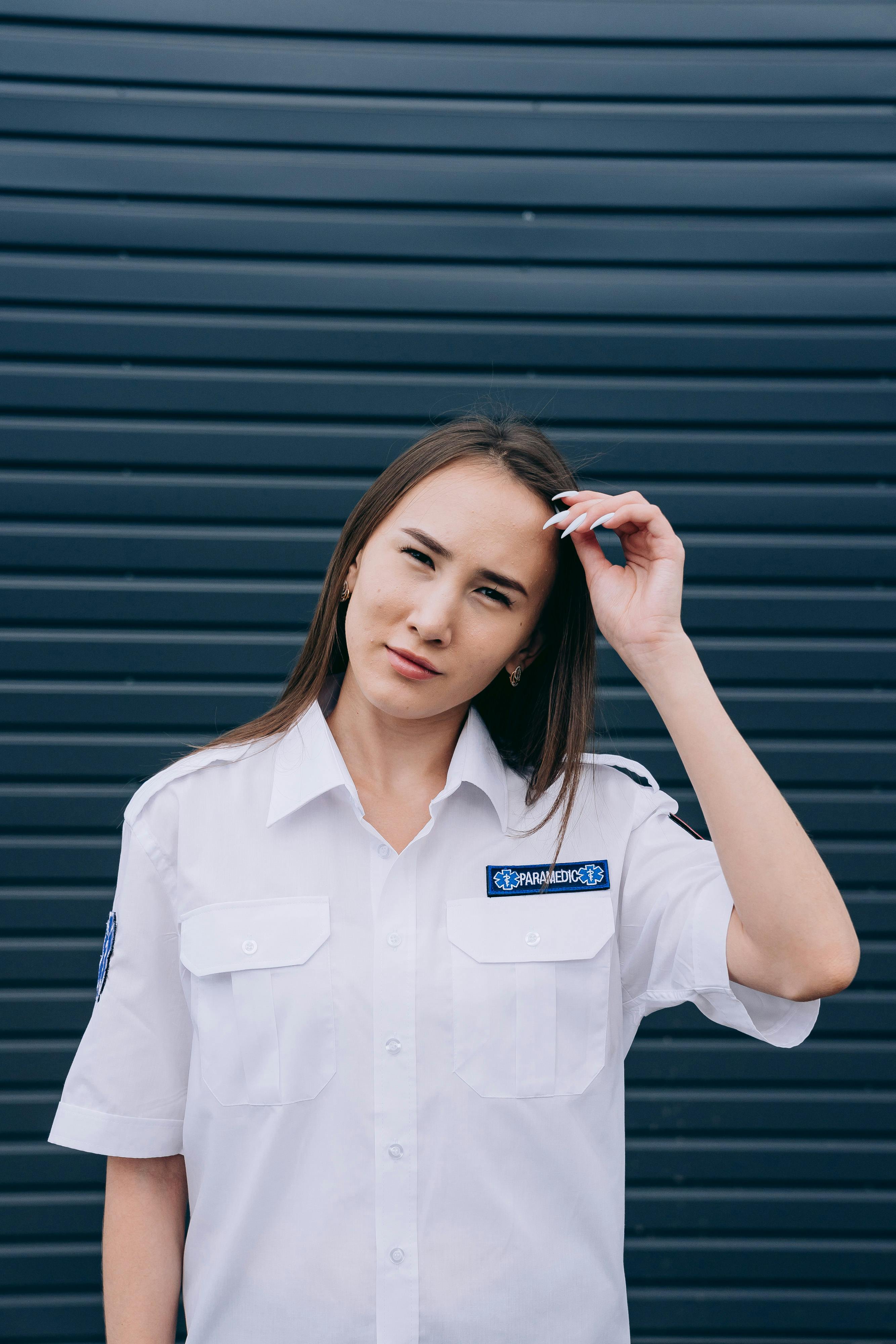 a woman wearing a white polo shirt