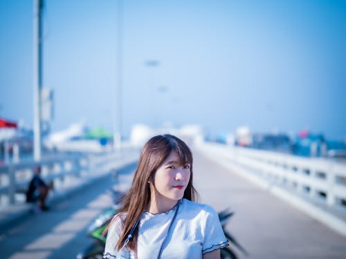 Woman Standing on the Bridge