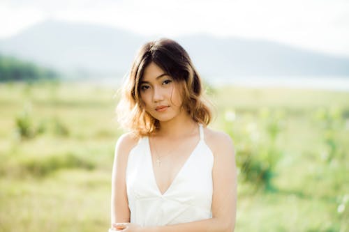 Woman in White Spaghetti Strap Dress