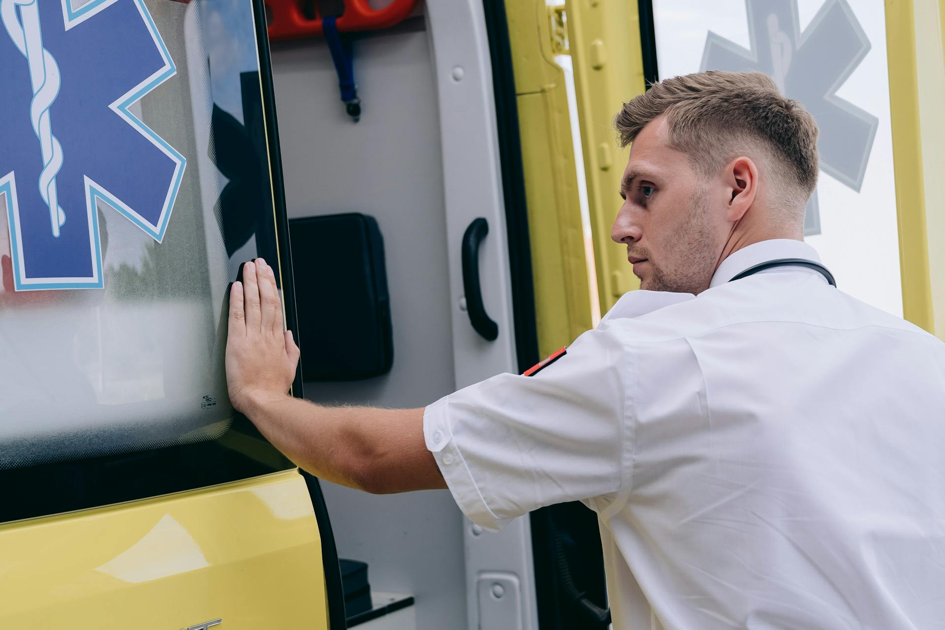 Medic Opening the Door of an Ambulance